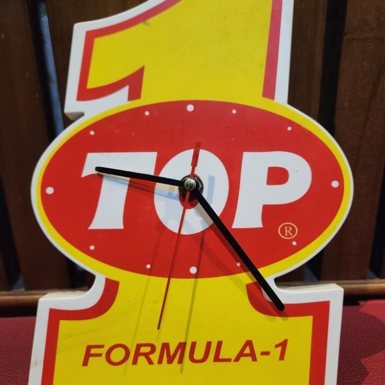 jam dinding jadul iklan oli top one