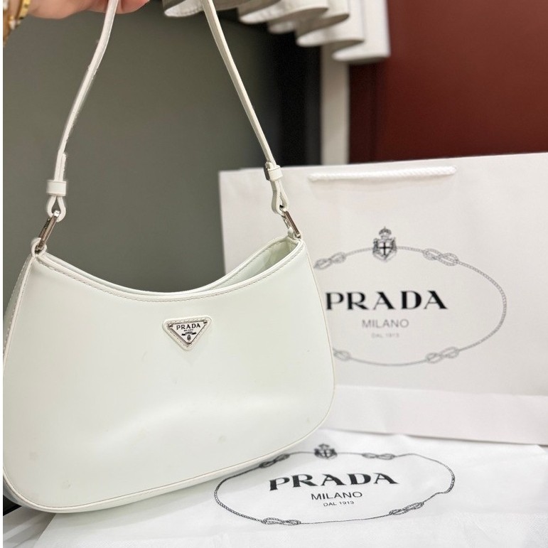 Tas Selempang Wanita PRADA Milano warna putih model bulan sabit dengan tali panjang