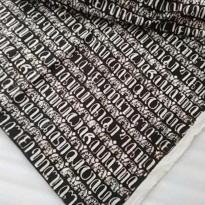 Kain batik cap sogan Jogja motif aksara jawa kembang