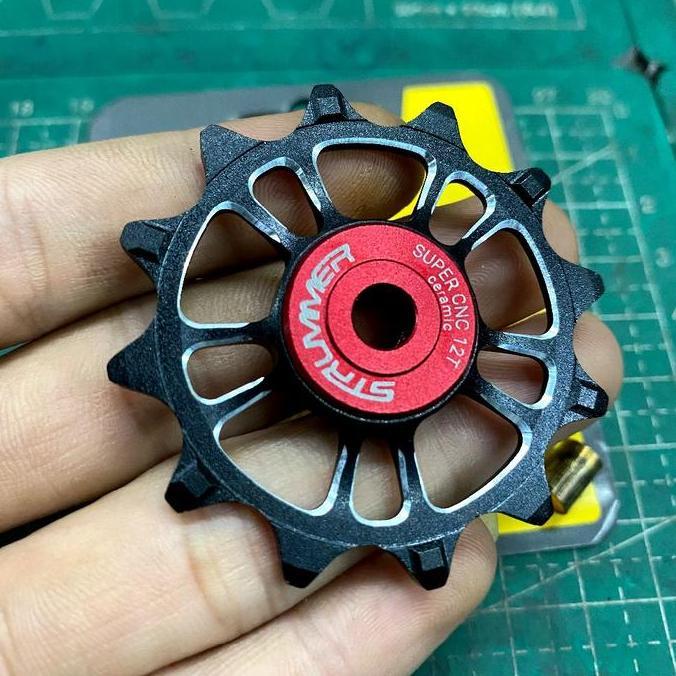 Strummer Bicycle Pulley Wheel Super Cnc 12T Ceramic Strummer Hitam Satuan - Pulley Strummer 12 T Cer