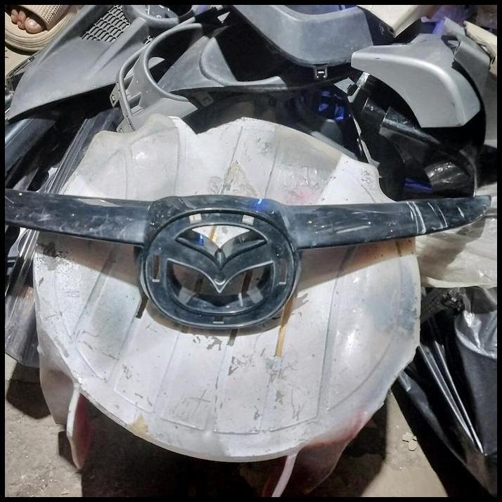 TERMURAH GARNIS GRILL ATAS MAZDA 2 TAHUN 2009-2012 ORIGINAL PART DI RJM 