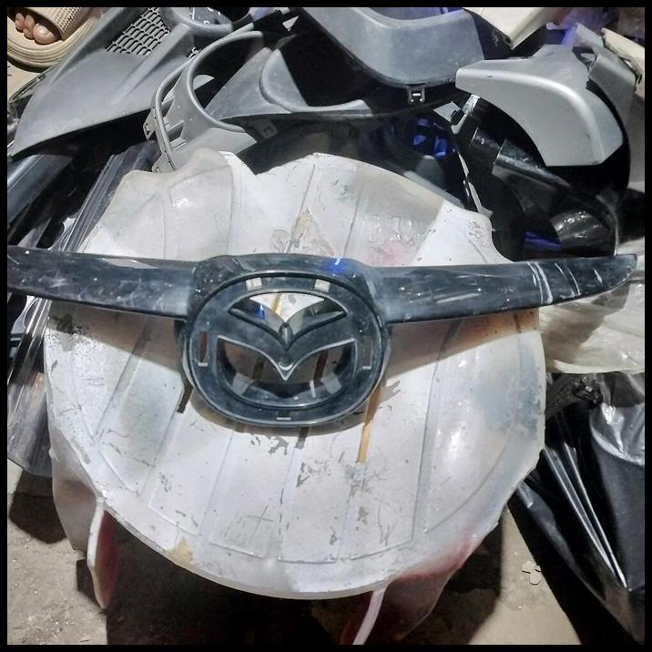 HOT DEAL GARNIS GRILL ATAS MAZDA 2 TAHUN 2009-2012 ORIGINAL PART DI RJM