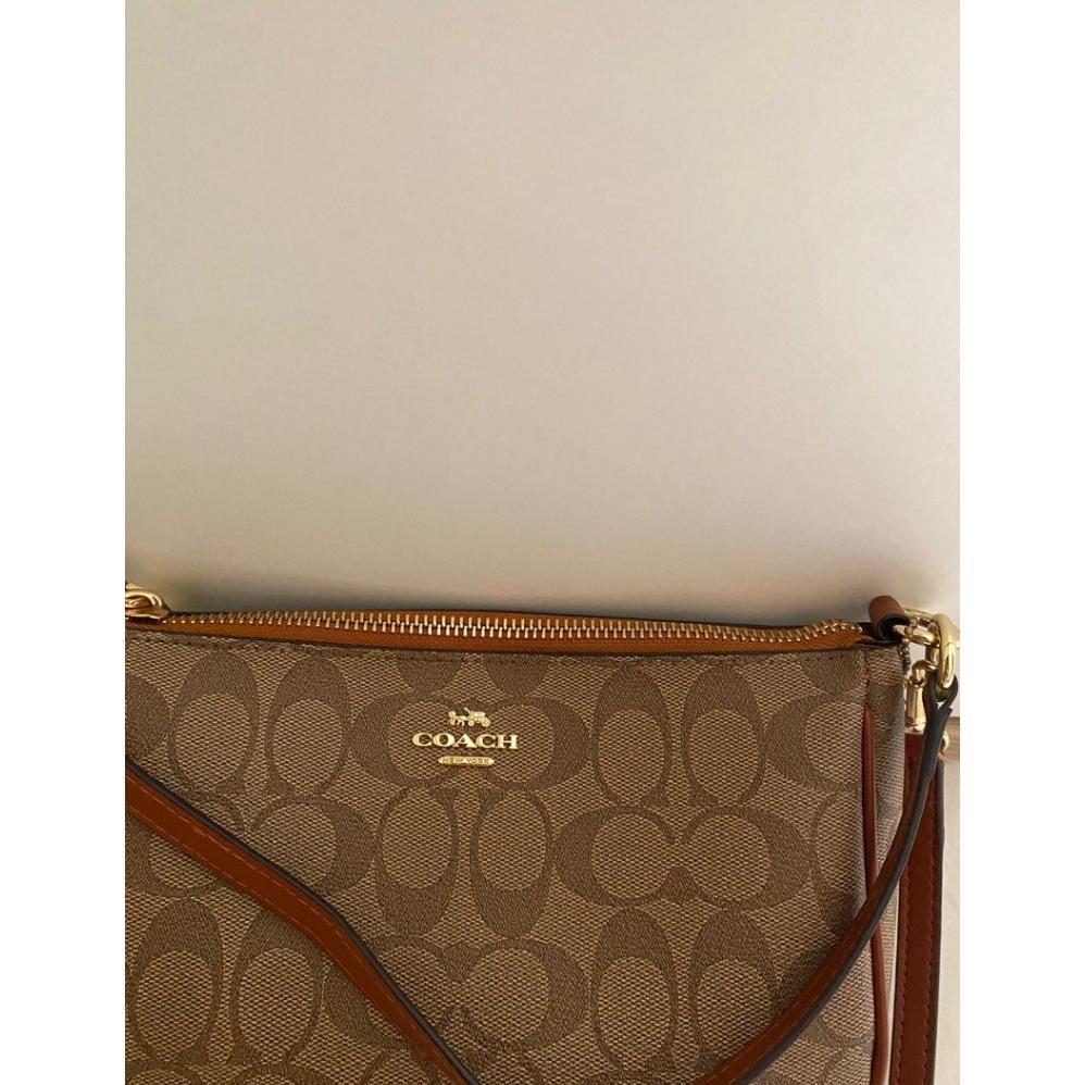 EXCLUSIVE 36674 F67567 WOMEN BAG TOP HANDLE POUCH IN SIGNATURE CANVAS 2026