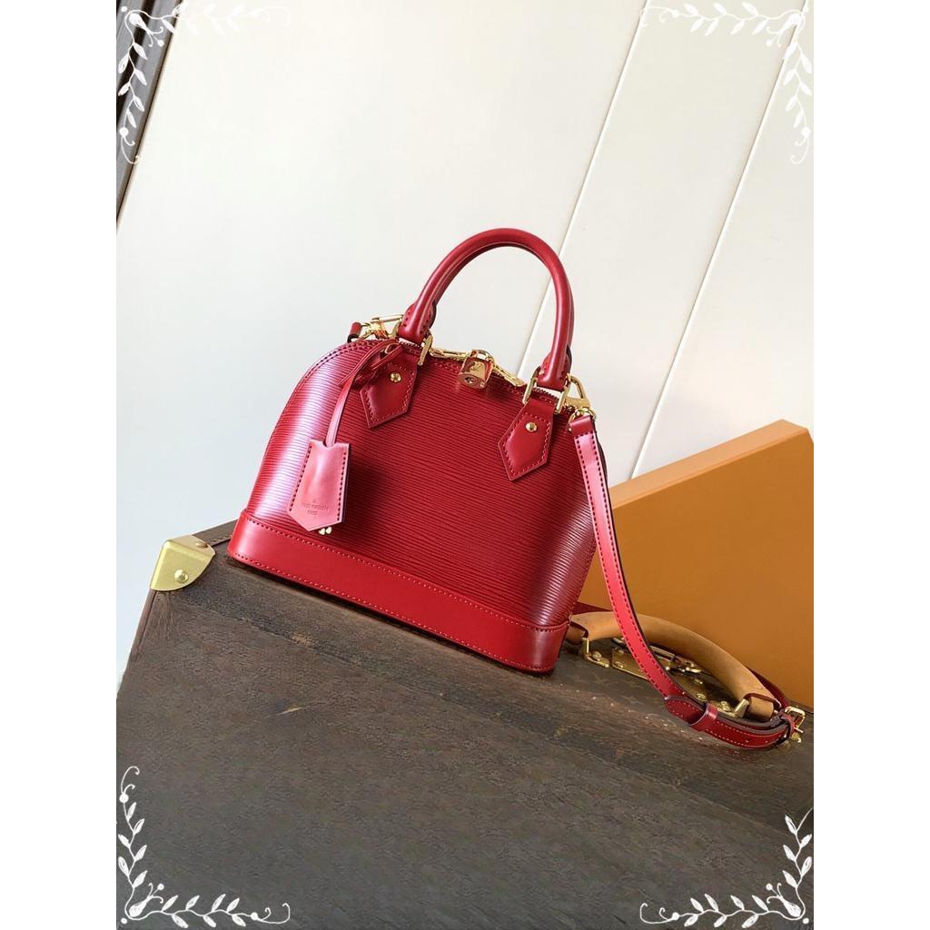 M24645 Lv Alma BB epi clamshell handbag with productive feet