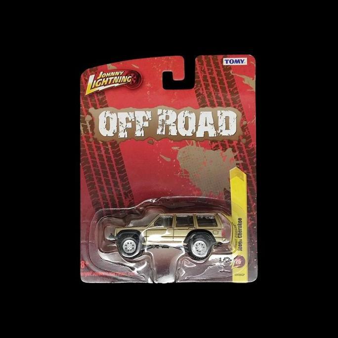 JOHNNY LIGHTNING OFF ROAD JEEP CHEROKE 25 GOLD TOMY RG99