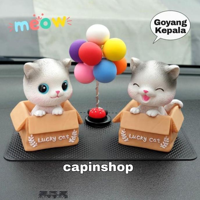 hiasan dashboard mobil kucing