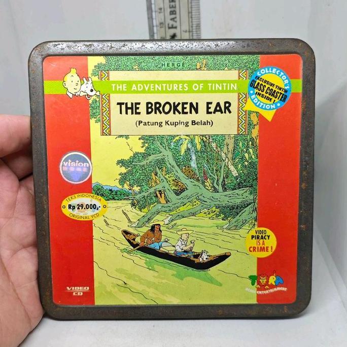 SET 2 PCS VCD KARTUN THE ADVENTURES OF TINTIN THE BROKEN EAR ORIGINAL TORA TIN CASE KALENG PS99