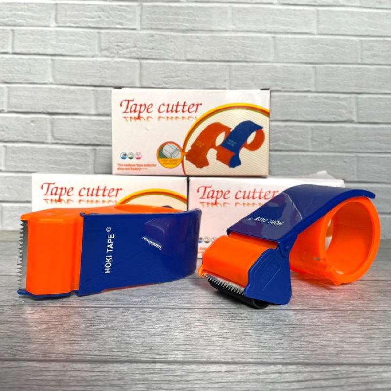 

TAPE DISPENSER CUTTER HOKI Rolan lakban kuat dan tajam