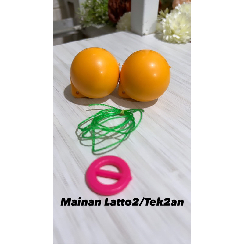 mainan latto latto atau tek2an