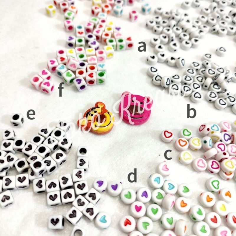 (Per Pack) Manik Mote love bulat pipih putih isi hitam - warna warni