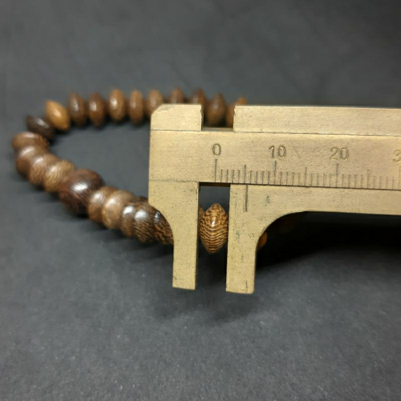 GELANG KAYU KELOR GEPENG MUDEL DONAT ISI 33BUTIR  TALI KARET