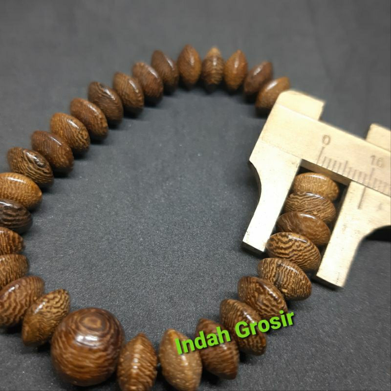 GELANG KAYU KELOR GEPENG MUDEL DONAT ISI 33BUTIR  TALI KARET