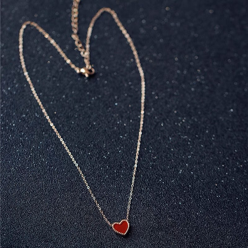 kalung hati merah titanium simple