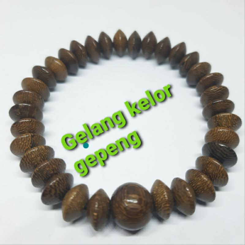 GELANG KAYU KELOR GEPENG MUDEL DONAT ISI 33BUTIR  TALI KARET