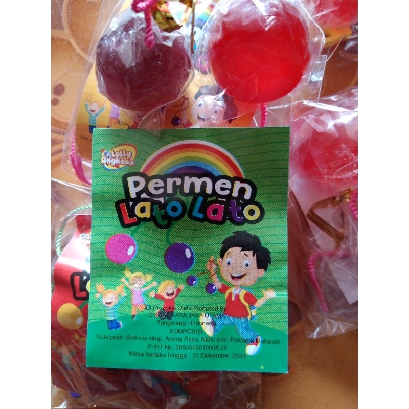 

Permen keras/lollipop bentuk lato-lato warna-warni.