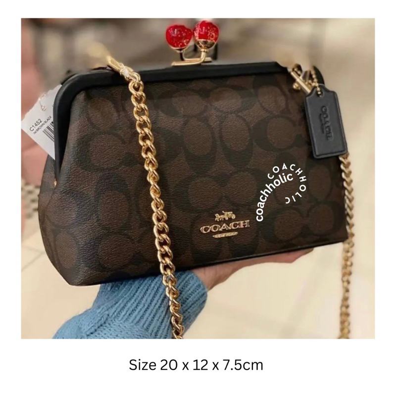 coach nora clutch tas pesta