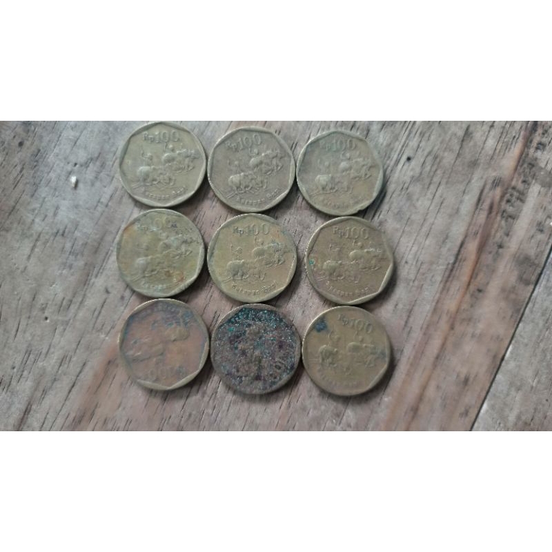 Uang 100 rupiah kuning karapan sapi bekas