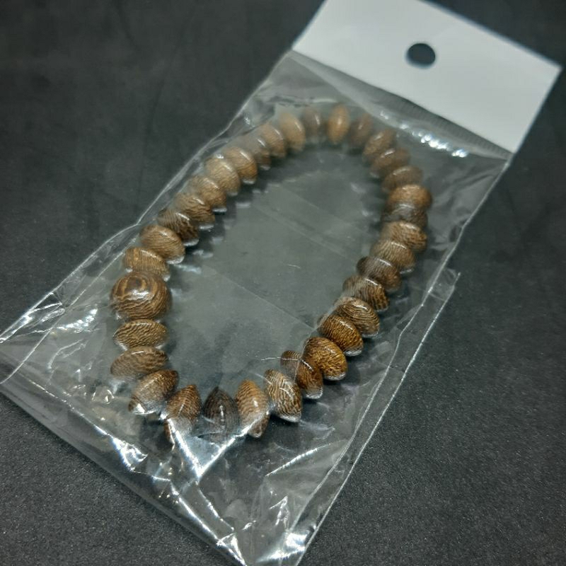 GELANG KAYU KELOR GEPENG MUDEL DONAT ISI 33BUTIR  TALI KARET