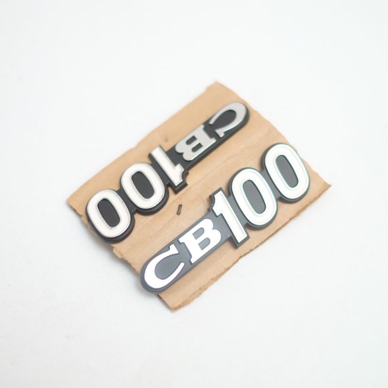EMBLEM LOGO KEMPOL BOX AKI HONDA CB100 K0 K1 ORIGINAL NOS ORI BARU