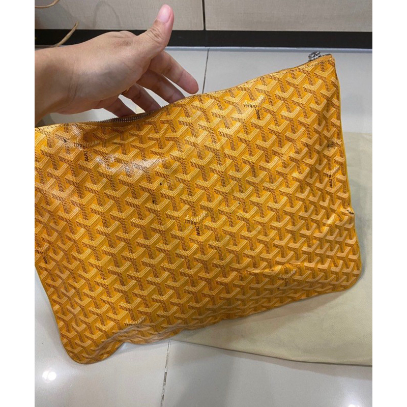 Yellow goyard clutch