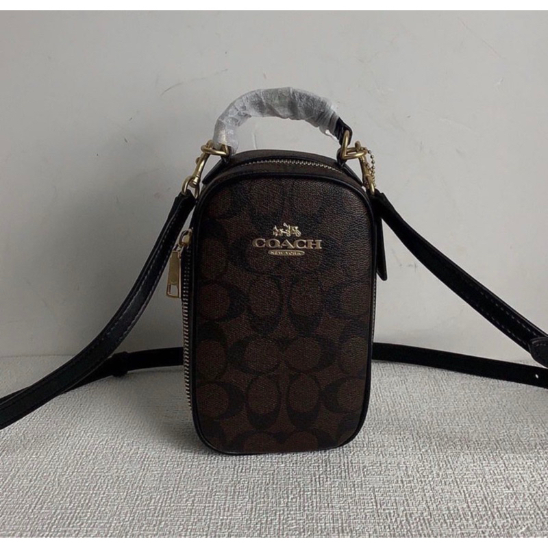 coach eva phone bag in signature