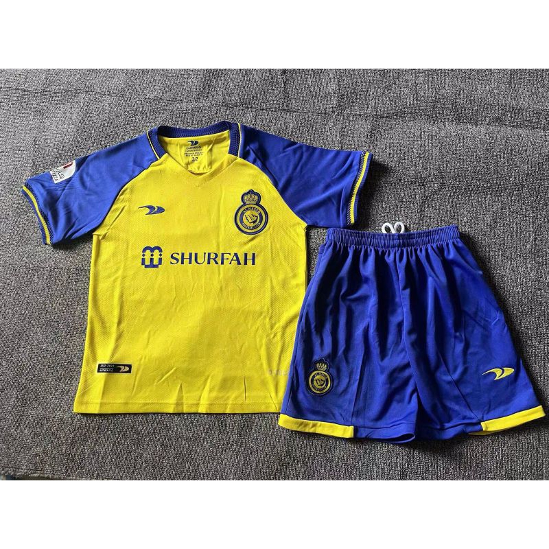 JERSEY BAJU BOLA ANAK AL NASSR HOME KIDS 2022/2023 RONALDO GRADE ORI