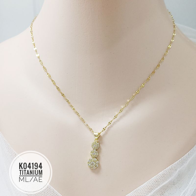 Kalung Titanium permata 3 tingkat gold K04194