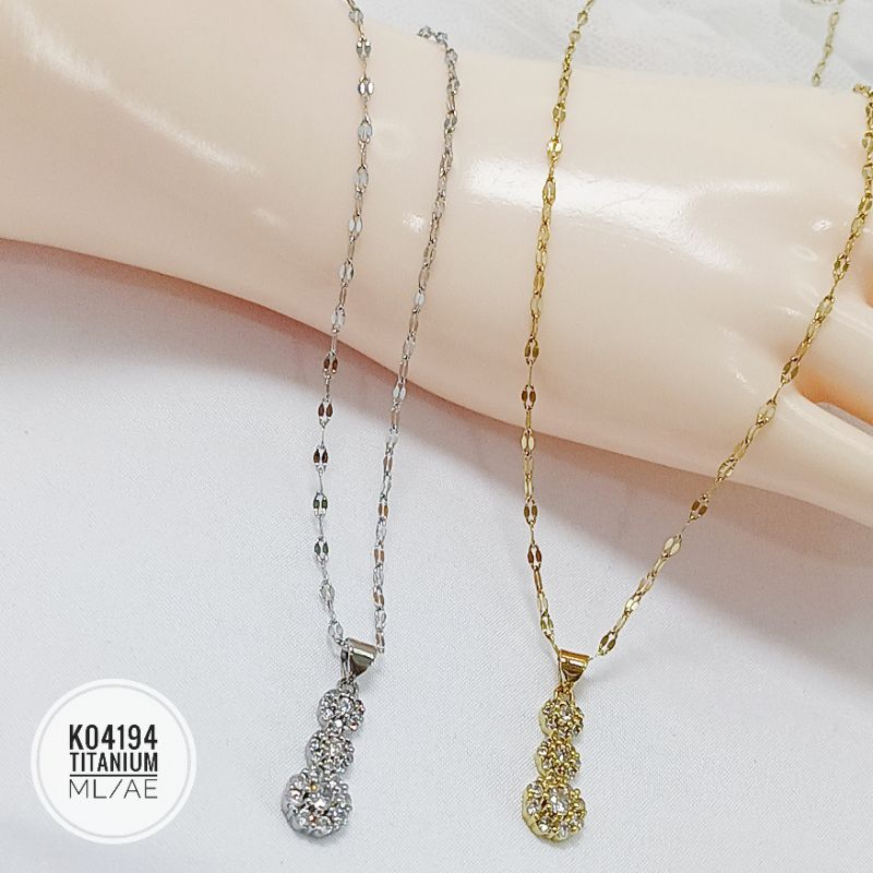 Kalung Titanium permata 3 tingkat gold K04194