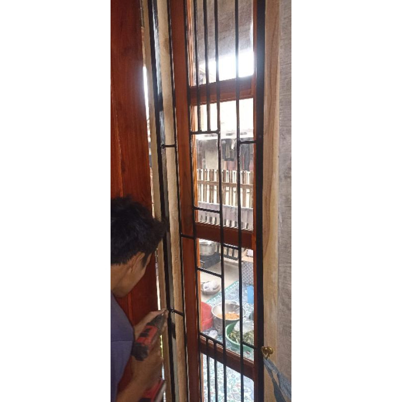 teralis pintu besi holo