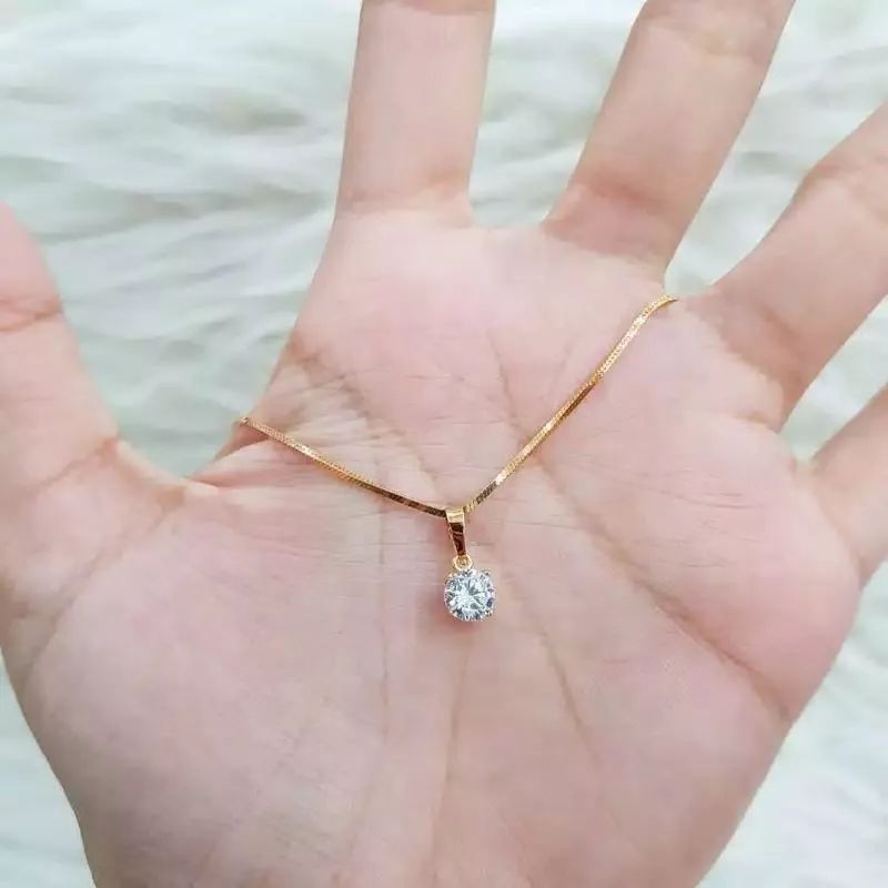 liontin bulat titanium mata satu antikarat