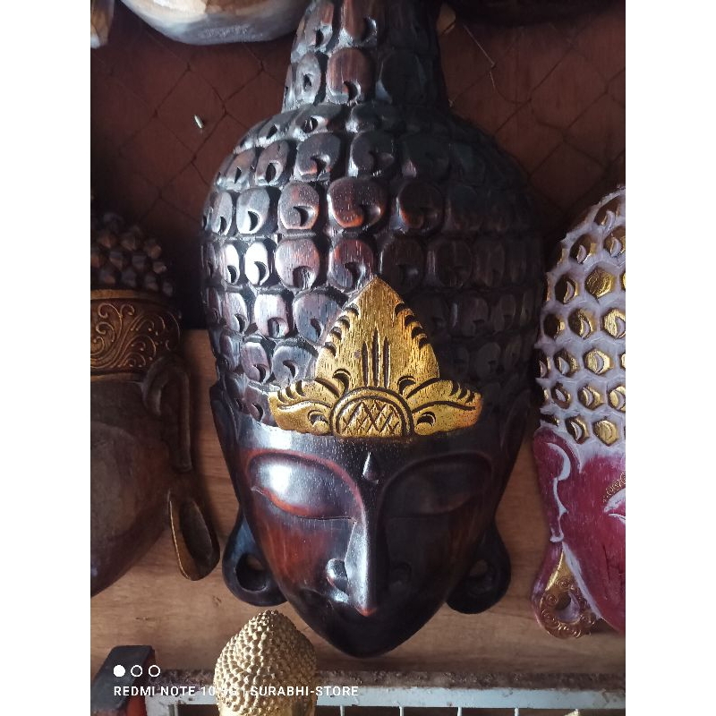 Topeng buddha pajangan dinding