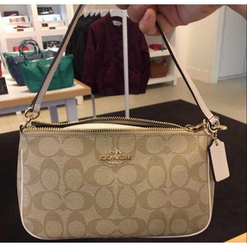 Coach top handle pouch in signature canvas