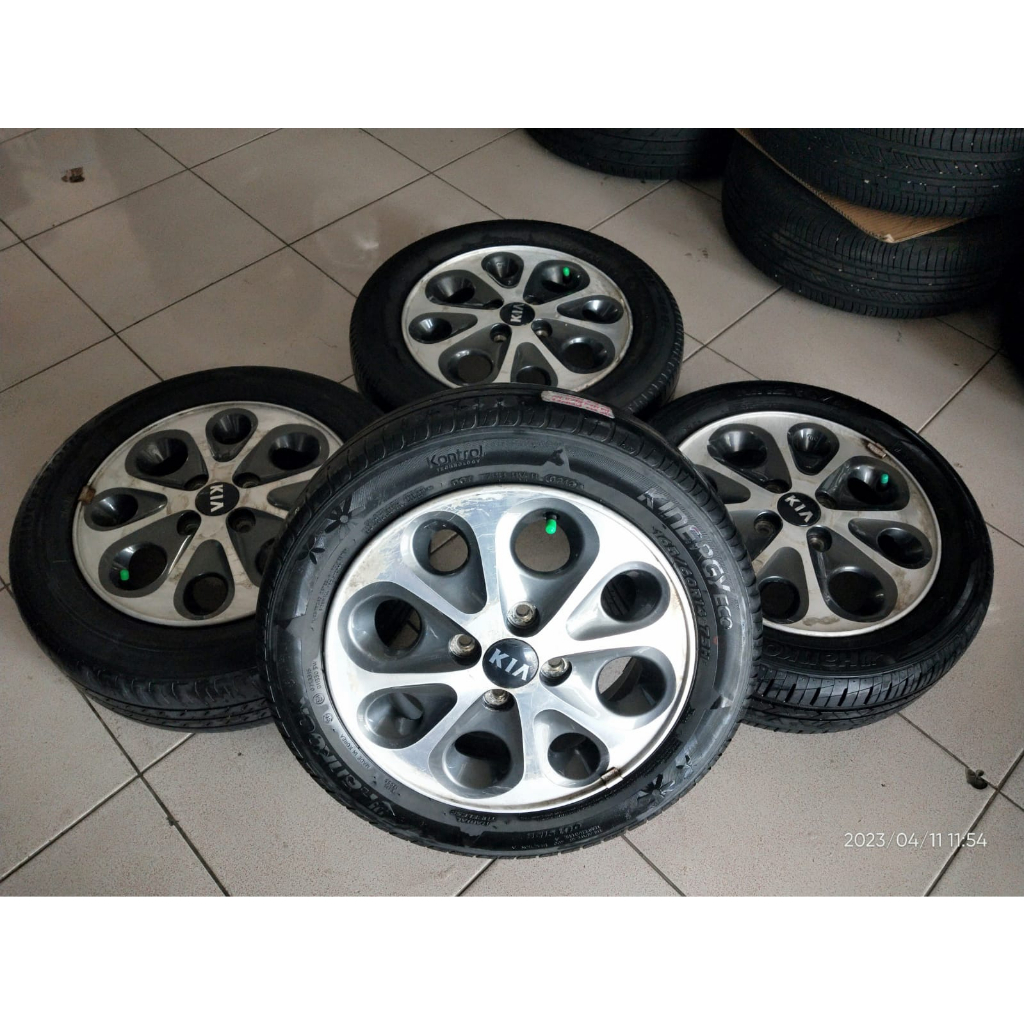 Velg Bekas Mobil KIA Murah Ring 14 Lebar 5 Inch Hole 4 x 100 Warna Grey Polish Plush Ban Layak Pake 