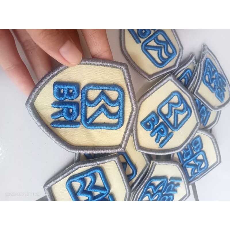 BORDIR LOGO BRI BARU BRI KREM/NAMTAG SATPAM BRI KREM