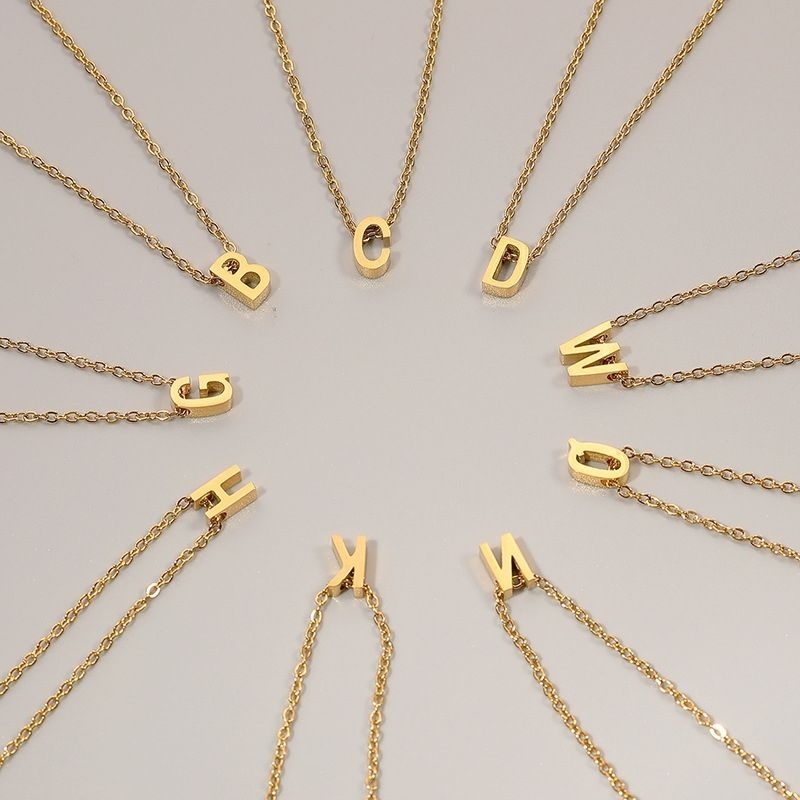 Kalung huruf titanium anti karat F49