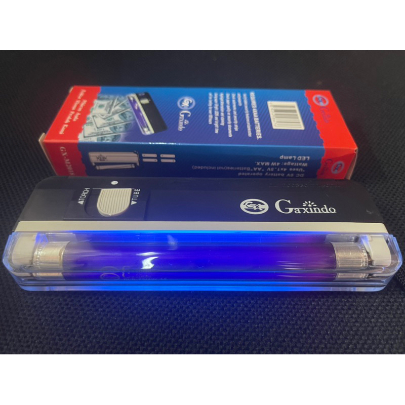 Lampu ultraviolet cek uang palsu portable Gaxindo + senter baterai AA