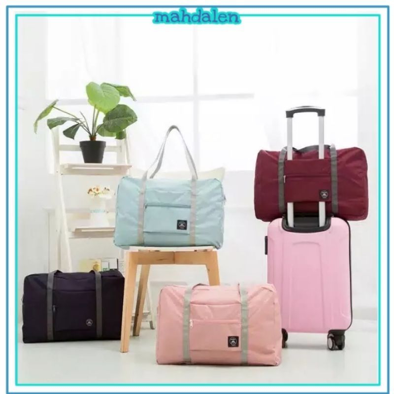 TAS TRAVEL LIPAT BESAR TAS DI ATAS KOPER