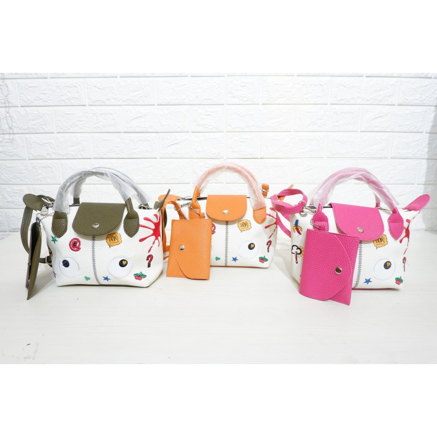 Tas selempang wanita motif bahan kulit jeruk sintetis