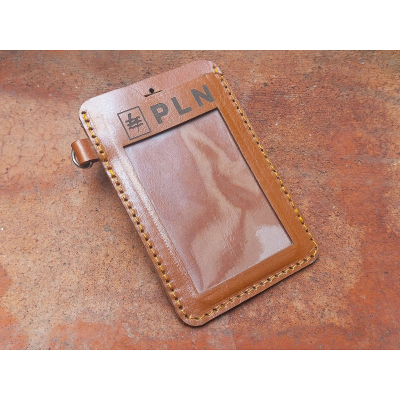 

Name tag Id kulit sapi asli warna tan custom logo PLN Garansi 1 Tahun