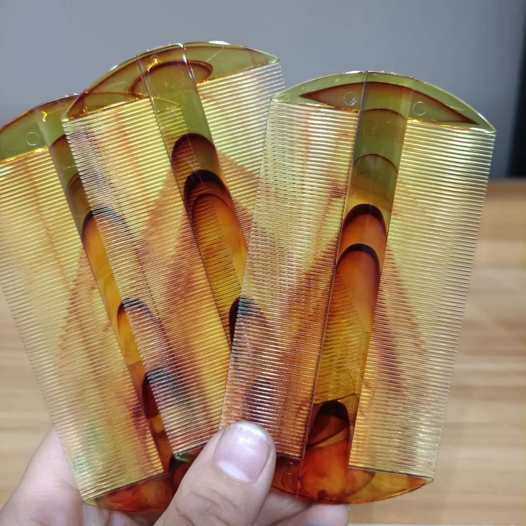 sisir kutu coklat bening dai mei jia