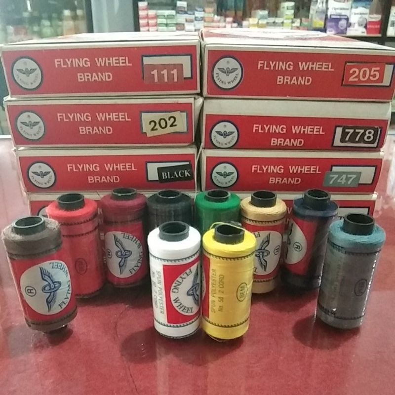 Benang jahit cap roda terbang ( flying wheel )