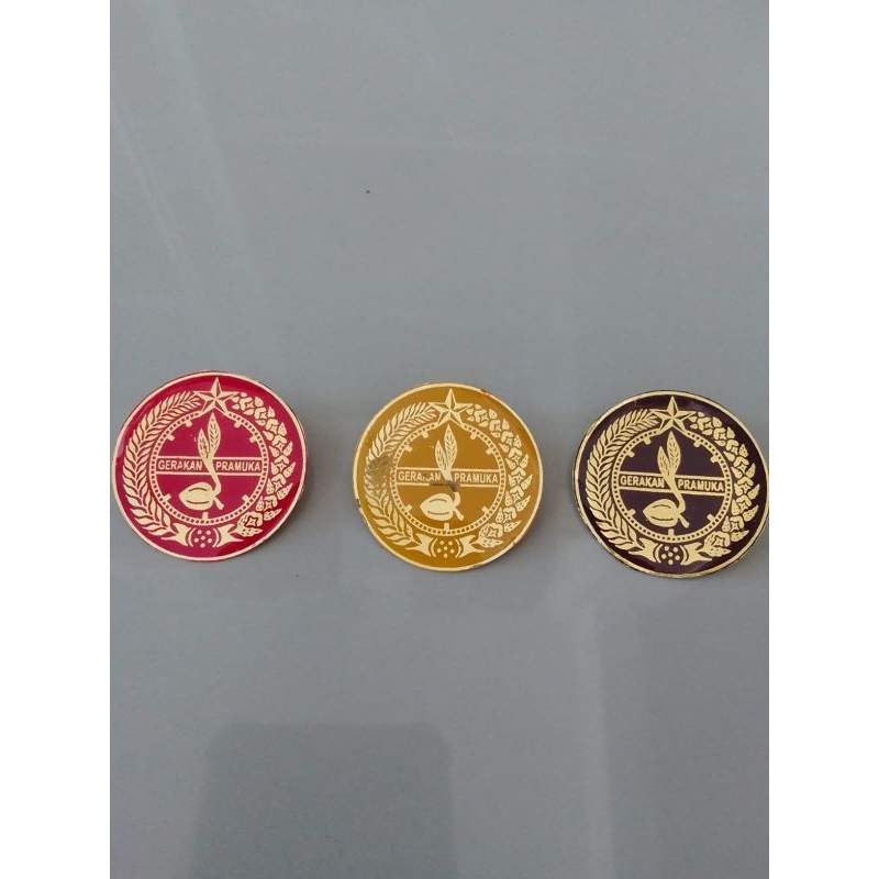 Tanda topi pramuka putri kuningan