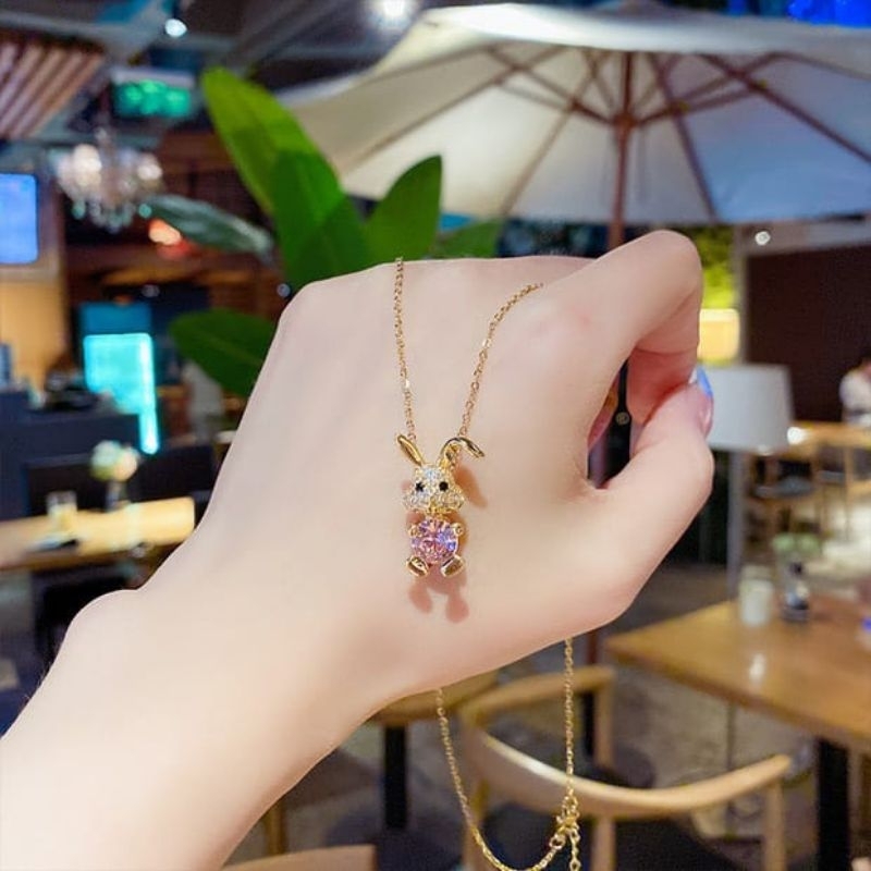 kalung titanium fashion kelinci mata pink dan putih