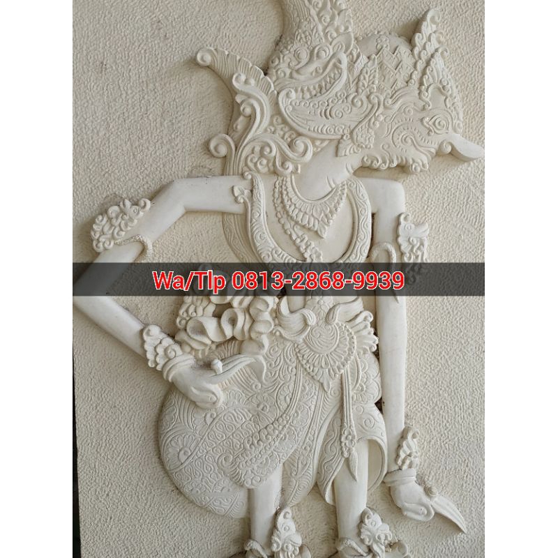 Relief batu alam motif wayang