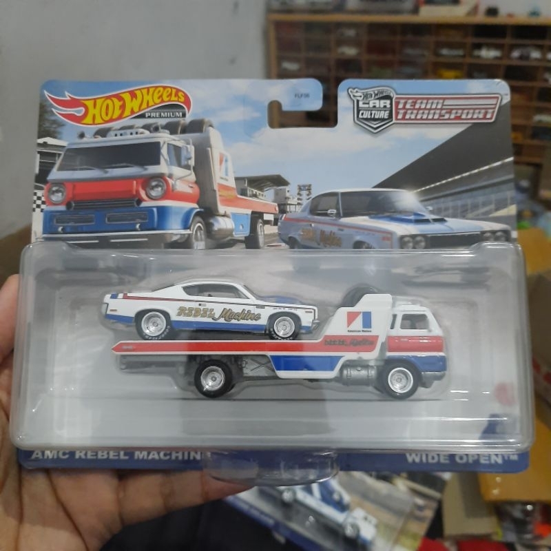 hotwheels premium amc rebel machine team transport wide open truk truck towing