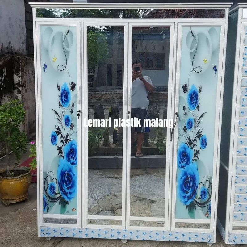 Lemari alumunium 4 pintu motif