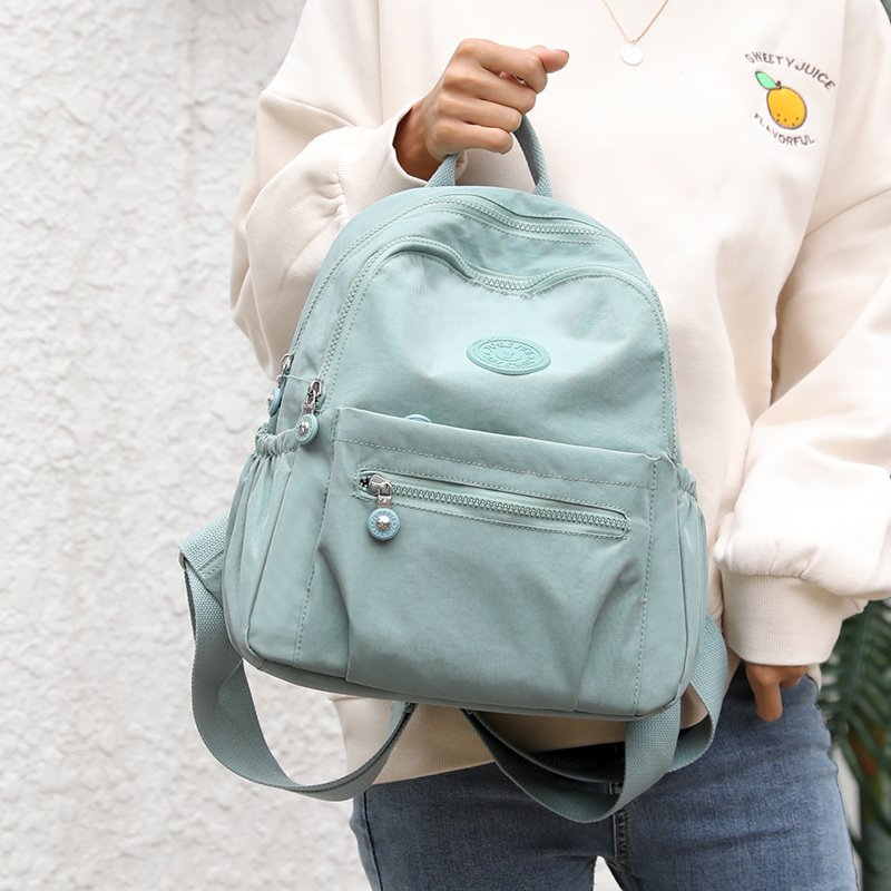 Musim panas wanita baru kapasitas besar ransel tahan air fashion tas sekolah perjalanan ringan Oxford Bunylon tren ransel