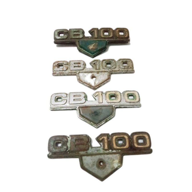 Emblem tepong kempol aki CB100 K3 original