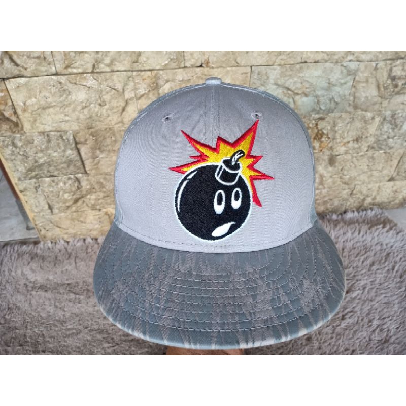 topi merk new era the hundreds