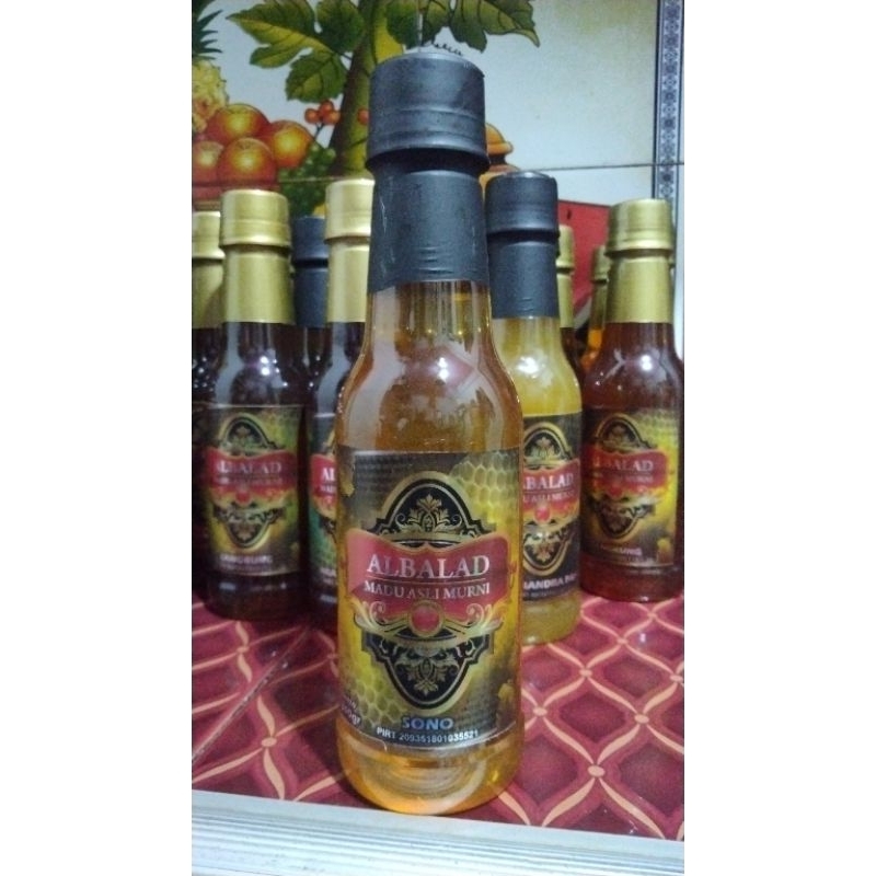 

MADU MURNI NEKTAR POHON KESAMBI العسل
